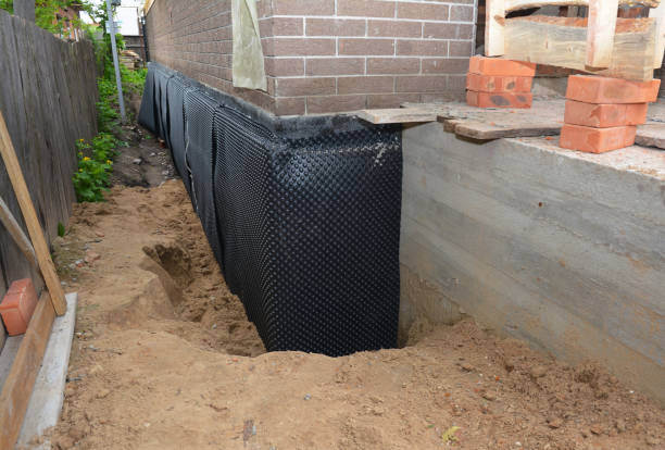 Happy homeowners after waterproofing job in Woodville